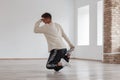A young man dancing break dance standing on his foot Royalty Free Stock Photo
