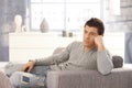 Young man daydreaming on sofa Royalty Free Stock Photo