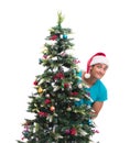 Young man decorating christmas tree isolated on white Royalty Free Stock Photo