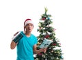 Young man decorating christmas tree isolated on white Royalty Free Stock Photo