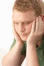 Young man deep in thought Royalty Free Stock Photo