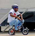 Young man demonstrates comedic version of bicycle safety Royalty Free Stock Photo