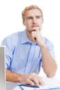 Young man at office thinking Royalty Free Stock Photo