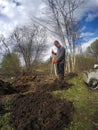 The young man digs the earth a shovel for beds. Early spring Royalty Free Stock Photo