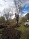 The young man digs the earth a shovel for beds. Early spring Royalty Free Stock Photo