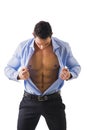 Young man displaying his abdominal muscles Royalty Free Stock Photo