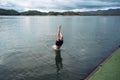 Young man diving into lake in dam Royalty Free Stock Photo