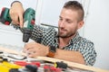 Young man DIY using electric drill Royalty Free Stock Photo