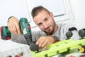 Young man DIY using electric drill Royalty Free Stock Photo