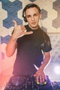 Young man DJ with mixer is working Royalty Free Stock Photo