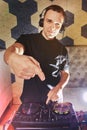 Young man DJ with mixer is working Royalty Free Stock Photo