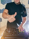 Young man DJ with mixer is working Royalty Free Stock Photo