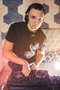 Young man DJ with mixer is working Royalty Free Stock Photo