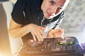 Young man DJ with mixer is working Royalty Free Stock Photo