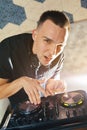 Young man DJ with mixer is working Royalty Free Stock Photo
