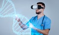 Young man doctor wearing VR glasses in future of healthcare conducts precise CRISPR edits on virtual DNA