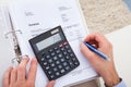 Young Man With Documents And Calculator Royalty Free Stock Photo