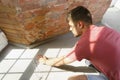 Young man doing apartment repair hisselfes Royalty Free Stock Photo