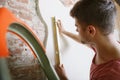 Young man doing apartment repair hisselfes Royalty Free Stock Photo