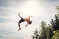 Young man doing a backflip in the air. Royalty Free Stock Photo