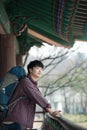 Young man doing a backpacking trip in a Korean traditional house. Royalty Free Stock Photo