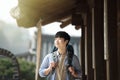 Young man doing a backpacking trip in a Korean traditional house. Royalty Free Stock Photo
