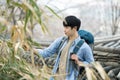 Young man doing a backpacking trip in a Korean traditional house. Royalty Free Stock Photo