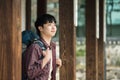 Young man doing a backpacking trip in a Korean traditional house. Royalty Free Stock Photo