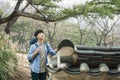 Young man doing a backpacking trip in a Korean traditional house. Royalty Free Stock Photo