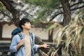 Young man doing a backpacking trip in a Korean traditional house. Royalty Free Stock Photo