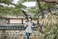 Young man doing a backpacking trip in a Korean traditional house. Royalty Free Stock Photo