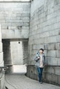 Young man doing a backpacking trip in a Korean traditional house. Royalty Free Stock Photo