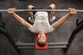 Young man doing bench press workout in gym Royalty Free Stock Photo