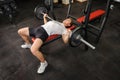 Young man doing bench press workout in gym Royalty Free Stock Photo