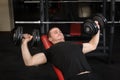 Young man doing bench press workout in gym Royalty Free Stock Photo