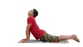 Young man doing cobra stretch on exercise mat during yoga class at retreat center Royalty Free Stock Photo