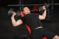 Young man doing Dumbbell Incline Bench Press workout in gym Royalty Free Stock Photo