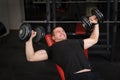 Young man doing Dumbbell Incline Bench Press workout in gym Royalty Free Stock Photo