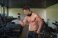 Young Man Doing Exercise For Biceps With Dumbbells Royalty Free Stock Photo