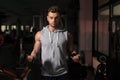 Young Man Doing Exercise For Biceps With Dumbbells Royalty Free Stock Photo