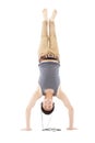 Young man doing a handstand against and listening music Royalty Free Stock Photo