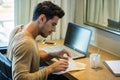 Young Man with Doing Homework at Computer Desk