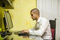 Young Man with Doing Homework at Computer Desk