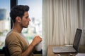 Young Man with Doing Homework at Computer Desk