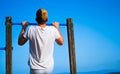 young man doing pullups Royalty Free Stock Photo