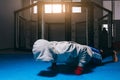 Young man doing push ups in boxing centre, warming up before workout. Royalty Free Stock Photo