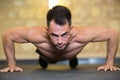 young man doing push ups in gym Royalty Free Stock Photo