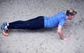 Young man doing pushups in the sand Royalty Free Stock Photo