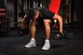 Young man doing Seated Bent Over Dumbbell Reverse Royalty Free Stock Photo