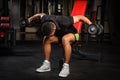 Young man doing Seated Bent Over Dumbbell Reverse Royalty Free Stock Photo